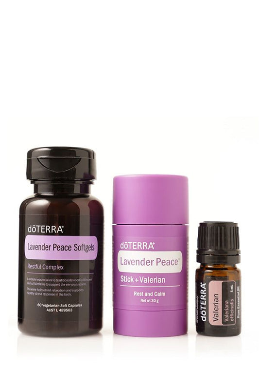Set of doTERRA Lavender Peace Softgels, Stick + Valerian essential oil in small bottles, lavender and purple packaging for natural sleep support